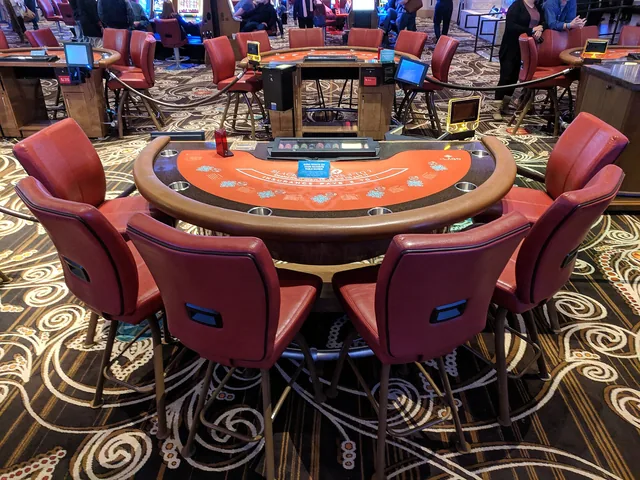 Empty table-game seats on a casino floor
