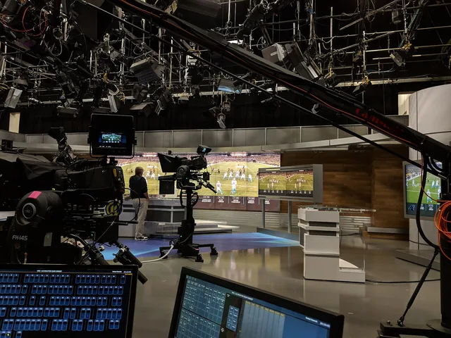 Television sports studio with cameras and lighting rig