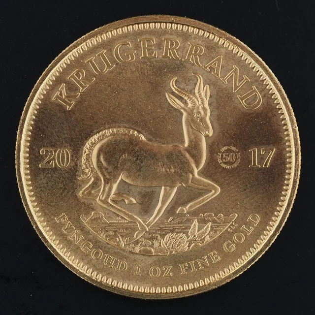 Gold Krugerrand coin showing a springbok